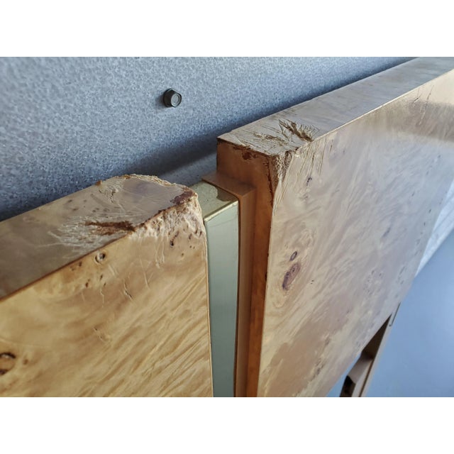 Maple burlwood and brass accents have to be one of our favorite pairings. The headboard will fit a full/double mattress or...