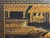 A mid 20th Century Chinoiserie decorated room divider screen with six panels. The black lacquer finish is decorated in...