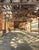 Beneath the El 1 by Jim Beckner | Oil on canvas board City street scene under an elevated train. For Sale