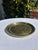 Vintage solid brass tray featuring delicate etched starburst detailing along the inner border and a subtle geometric motif...
