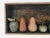 5 apples and 5 pears made of wood, ceramic, bronze and gourd in a vintage wood box.