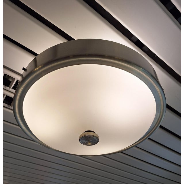 Modernist ceiling chandelier by Lumi Milano, 1950s. Satin glass diffuser with a brushed aluminum ring to close. Nickel-...