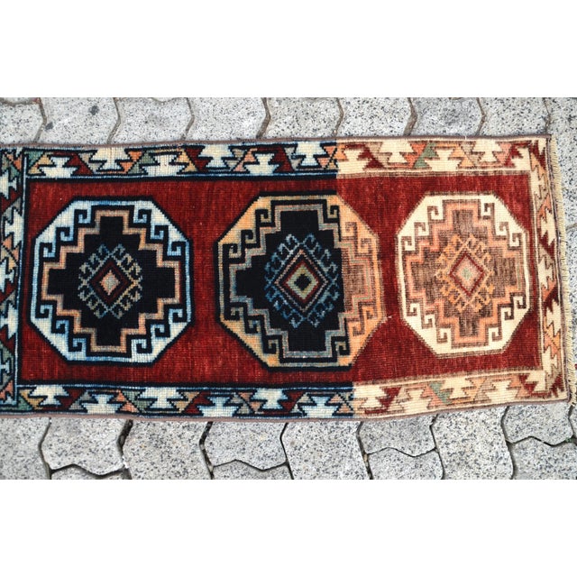 This is a vintage Turkish Oushak rug from the 1960s. The piece was hand-knotted.