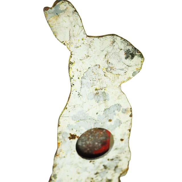 An early 20th century American shooting gallery target in the form of a white rabbit with several coats of old paint. The...