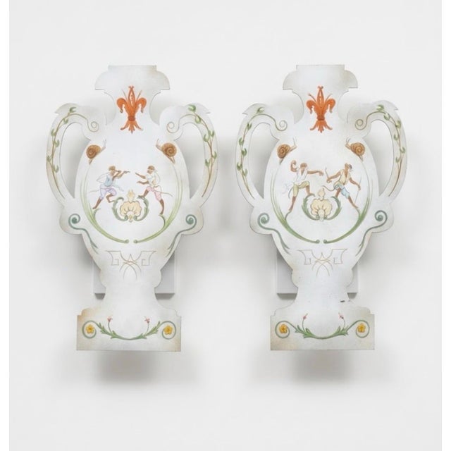 This matching pair of vintage wall-mounted sconces combines classical silhouette styling with charming hand-painted...