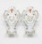 This matching pair of vintage wall-mounted sconces combines classical silhouette styling with charming hand-painted...