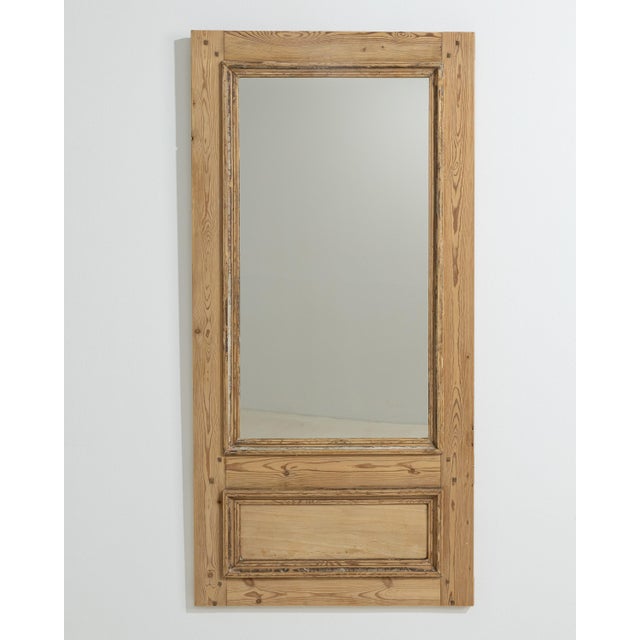 A 19th century French trumeau mirror crafted in wood, traditionally designed for placement above a fireplace. The...