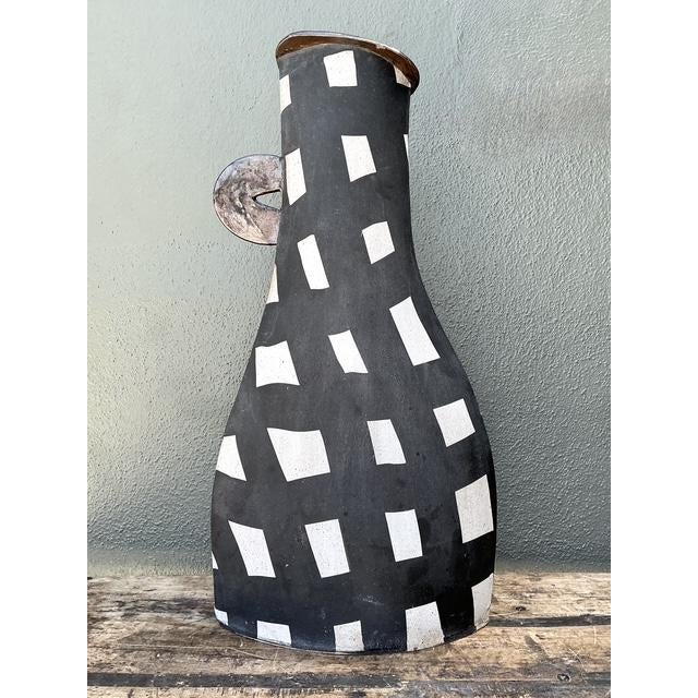 This monumental studio pottery vase is a tour de force of Postmodern design, channeling the bold graphic energy of the...