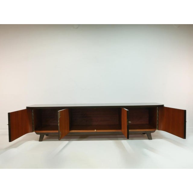 This exceptional lowboard dates back to the 1960s and was originally part of a high-quality living room wall unit. Today,...