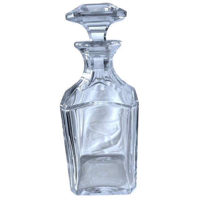 An elegant and substantial Harcourt 1841 crystal whiskey decanter, produced by the renowned French crystal house Baccarat....