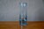 This bluish glass bud vase is a Swedish artistic piece, likely by Holmegaard, dating from the 1950s. Crafted with soft,...