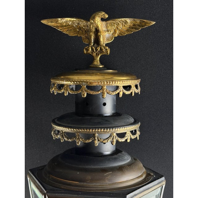 Exceptional late-19th to early-20th-century French Empire Revival wall lantern featuring a tall architectural form, gilt...