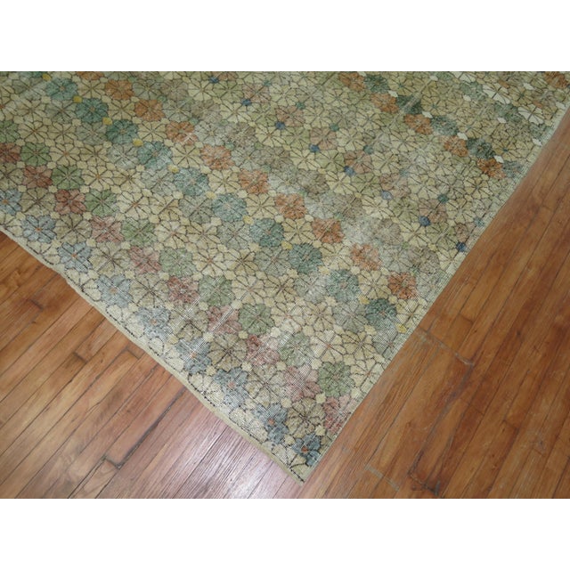 A worn circa mid-20th century rustic color Turkish Deco rug Measures: 6'11'' x 10'4”.