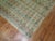 A worn circa mid-20th century rustic color Turkish Deco rug Measures: 6'11'' x 10'4”.