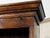 An English oak Welsh dresser from the 19th century, with open shelves, petite hooks and low sideboard with two doors,...