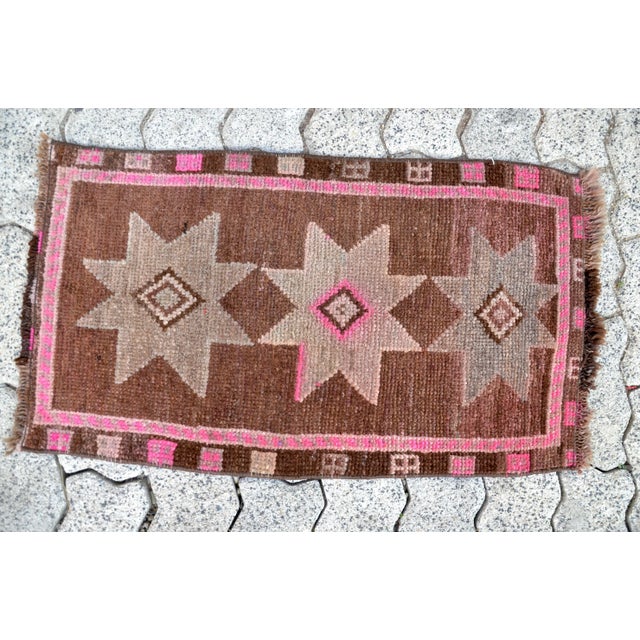 This is a vintage Turkish Oushak rug from the 1960s. The piece was hand-knotted.
