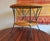 Finely made bamboo / rattan and iron two-level coffee table dating from the 1960s.