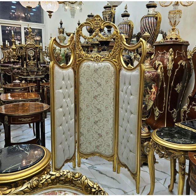 This elegant French-style paravan room divider features a soft off white upholstery beautifully complemented by a richly...