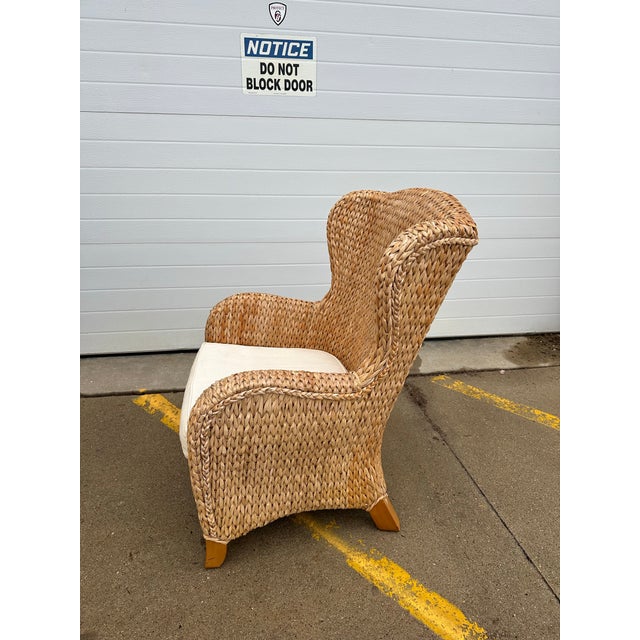 Vintage Pottery Barn seagrass wing chair and ottoman . From the Seagrass Collection. Chair measures 27” w x26” d x 39”h....