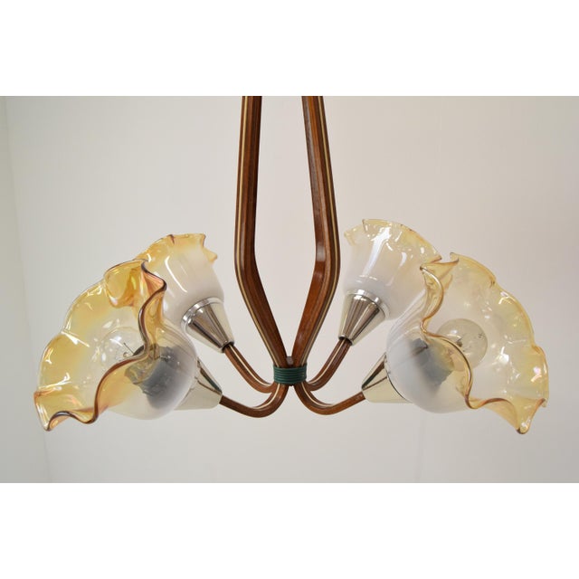 Made in czechoslovakia made of wood, metal and glass 4x40w, e27 or e26 bulb repolished with aged patina original condition...