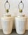 Pair of vintage 1980s plaster lamps. They feature a stacked ribbed design in an off-white finish.These lamps are designed...