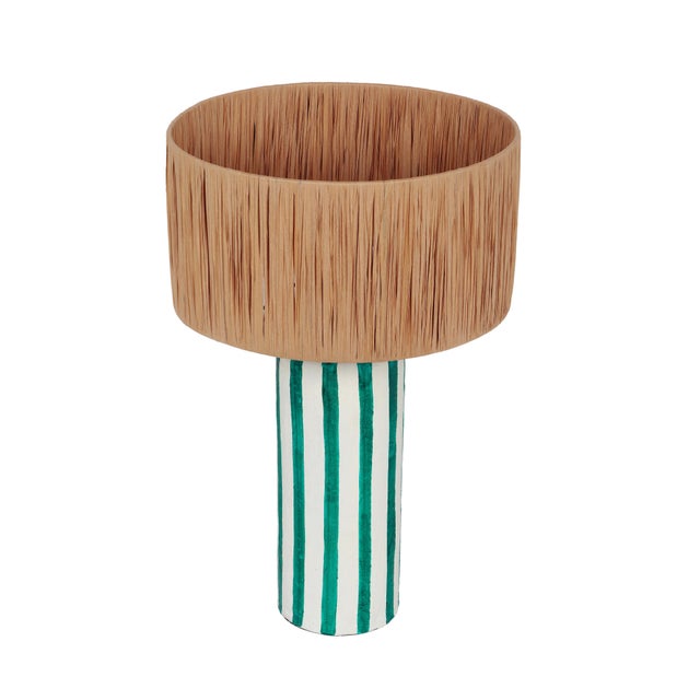 Introducing the Ravello Green Striped Papier Mache Table Lamp, a perfect fusion of fashion-forward design and artistic...