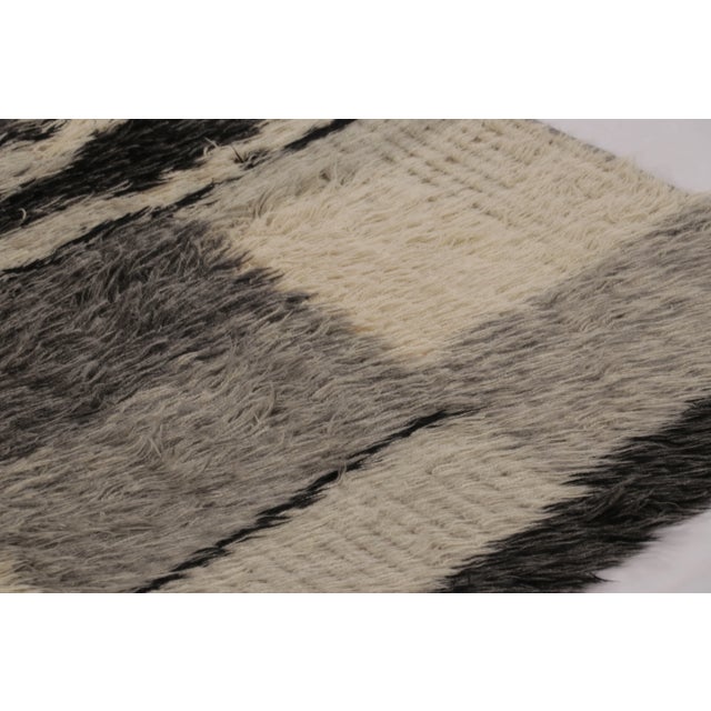 This vintage 3x5 Swedish shag rug is a distinctive mid-century piece, hand-knotted in wool circa 1950–1959. Its lush high-...