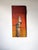 This artwork depicts a solitary bluebird perched on a weathered wooden post, set against a vibrant gradient of warm...