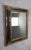 An elegant French carved giltwood mirror dating to the late 19th century, featuring a beautifully detailed giltwood frame...