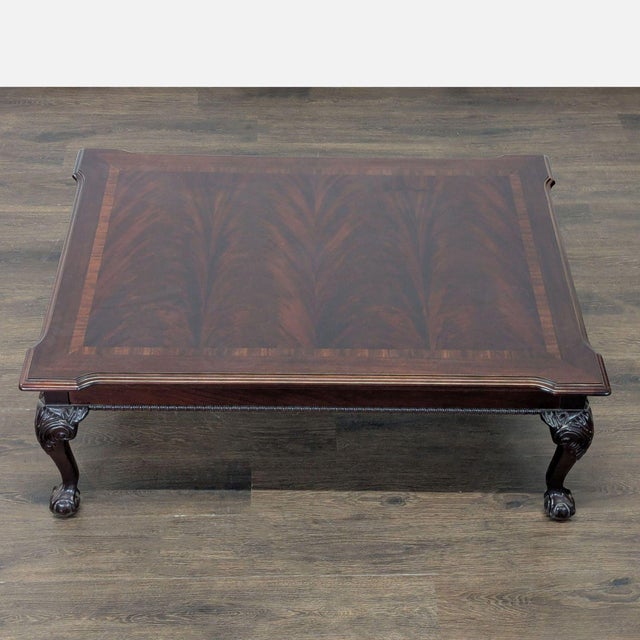 Vintage 1994 Thomasville coffee table in the English Chippendale style. Made of mahogany with a rectangular form and a...