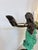 Dramatic Art Deco style dancer captured in an expressive sweeping pose, with outstretched arms, arched back, and...