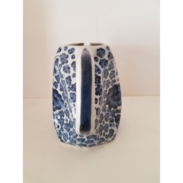 Vintage Blue & White Chinoiserie Ceramic beverage Pitcher. This pitcher has a very unique design. It is hand painted with...