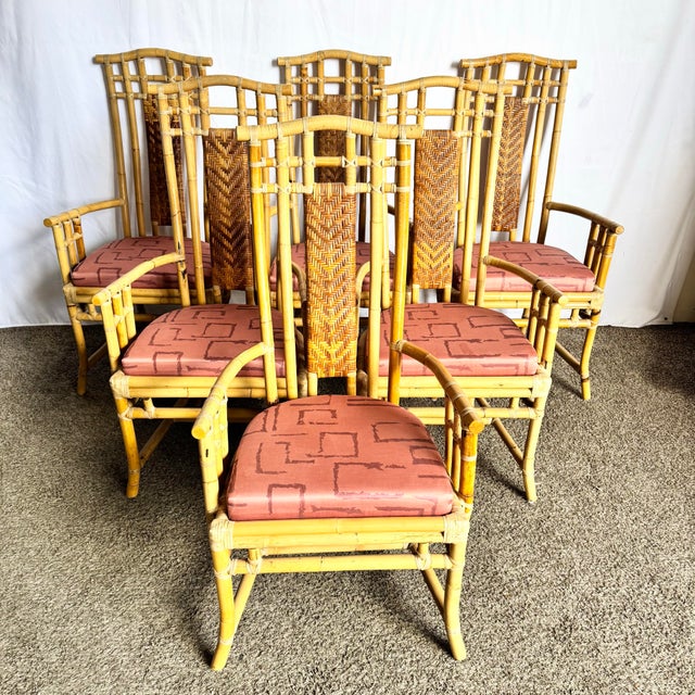 With sculptural curves and breezy charm, this set of six Boho Chic high-back dining arm chairs blends island elegance with...