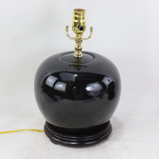 A Pair Early 20th Century Black Monochrome Porcelain Watermelon Jar Table Lamps on Carved Wood Bases For Sale - Image 9 of 15