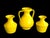 Offered is a set of 3 ceramic vases in a sunny lemon yellow designed by Aldo Londi for Bitossi in the 1960s and...