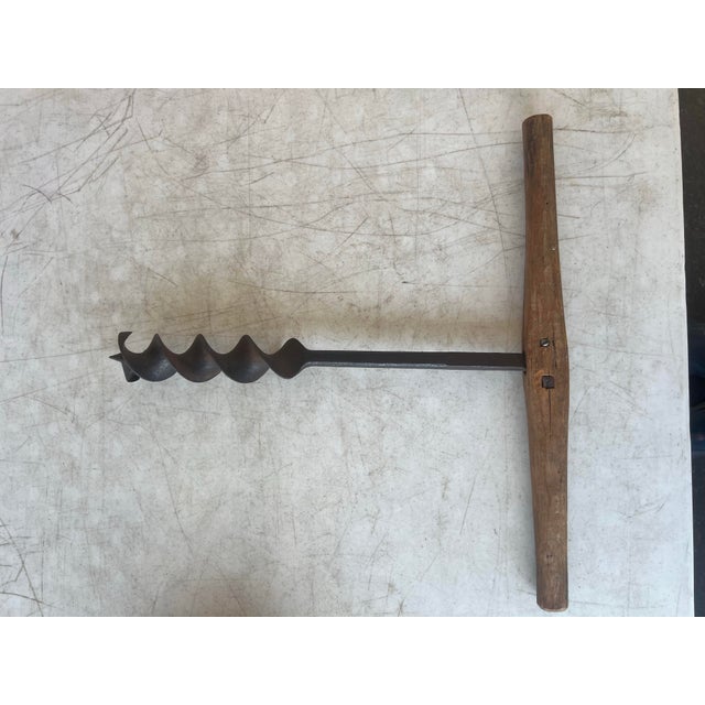 This is an antique or vintage T-handle wood auger, also known as a barn beam drill or timber frame auger. These tools were...