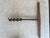 This is an antique or vintage T-handle wood auger, also known as a barn beam drill or timber frame auger. These tools were...