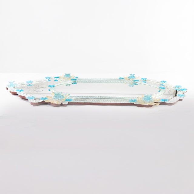 A lovely 49-inch tall mid‑century Venetian Murano glass wall mirror, adorned with hand‑applied aqua glass blossoms with...