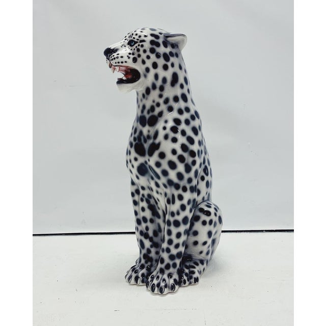 Unique handmade statue of a white leopard. This Hollywood Regency statue, crafted from hand-painted ceramic and made in...