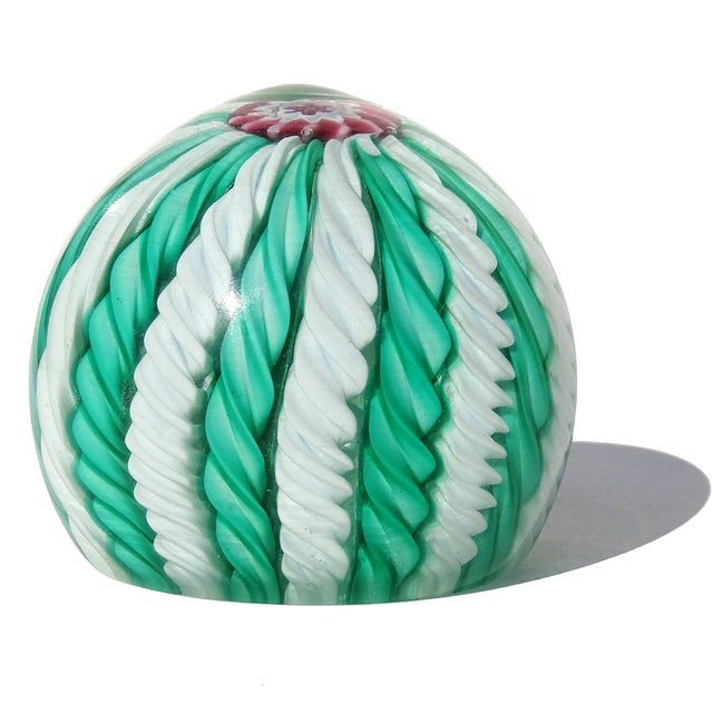 Beautiful and colorful vintage Murano hand blown green and white twisting ribbons Italian art glass paperweight. The piece...