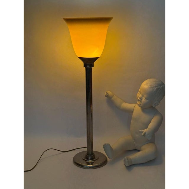 Beautiful French Art Deco style table lamp. The lamp dates from the late 1980s. Over time, it has developed a beautiful...
