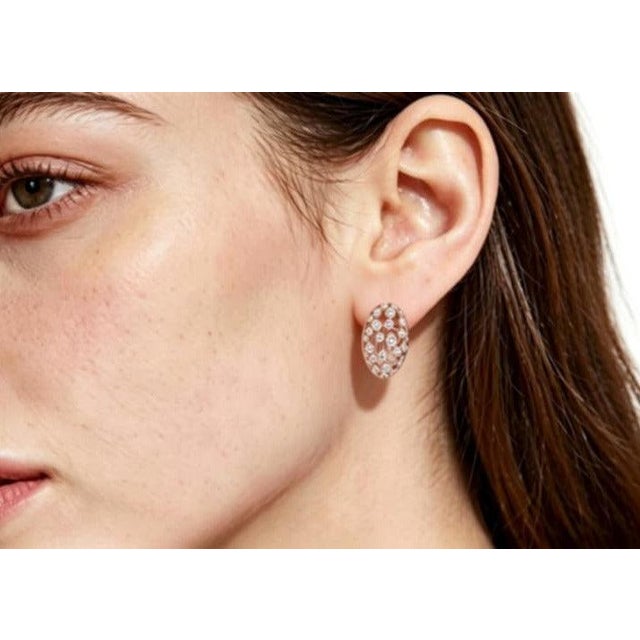 Elegant 18K pink rose gold French clip earrings featuring bezel-set multi-color diamonds totaling 1.5 carats. Estate...