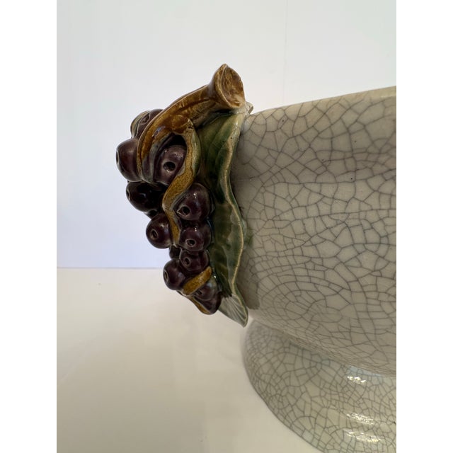 Grape clusters in high relief set beautifully atop this impressively large antique Majolica bowl circa 1950’s. The crackle...
