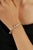 The 925 Sterling Silver Cubic Zirconia Bangle Bracelet showcases a sleek and elegant design accented with 0.65 carats of...