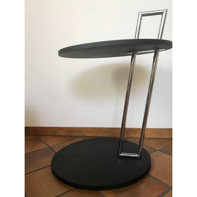 Round Black and Chrome Coffee Table by Eileen Gray, in Very Good conditions. Designed 1920 to 1949 This piece is...