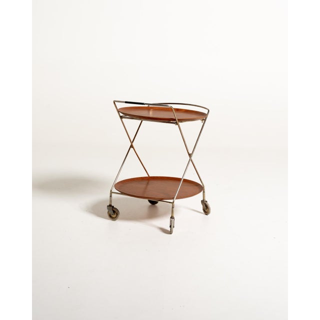 Folding metal trolley with two removable circular teak trays and four wheels. J-h fabrikerna, sävsjö, sweden, 1950s....