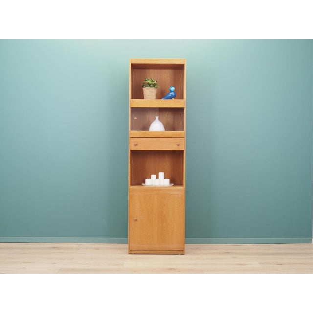 The bookcase was made in the 1970s, produced by the well-known Danish manufactory Skovby. The structure is covered with...