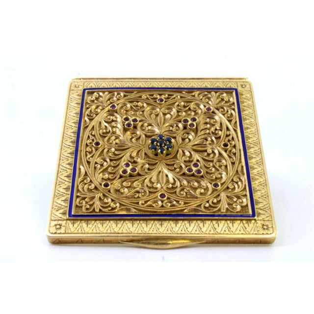 Gold toiletry box with geometric figures in relief on a finely enamelled panel, chiselled casing with profusely defined...