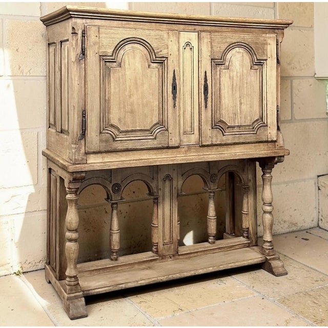 A remarkable example of 19th-century Country French craftsmanship, this raised cabinet was created from solid old-growth...