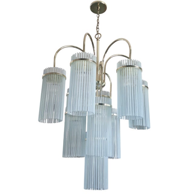 A spectacular 1970s Gaetano Sciolari nine-light chandelier, showcasing the designer's unmistakable blend of Italian...
